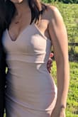 I love this dress! I wore it to two Spring/Summer weddings - and it was perfect! I was hoping to go bra-less, but the dress was a tad too big on top to do that with confidence, so I wore a sticky bra (which was also helpful in providing a bit of perk) - I maybe could have sized down because of this, but didn't have time to exchange. The material was thick enough to cover up any imperfections so I didn't feel like I had to wear spanks or suck anything in. I liked the length, but the dress did ride up as a I walked, so I spent a lot of time pulling it back down. But because of its original length I never felt uncomfortable. Ultimately, the dress is a perfect combination of sexy and modest, and I would definitely recommend! - Olivia P.