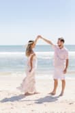 I could not have been happier with this dress. I used in it my engagement shoot and it fit perfectly, was so flattering, and went so well with our beach them. I'm over the moon with how our photos turned out, this dress was magical. - Aly K.