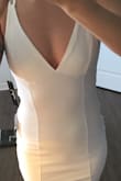 ABSOLUTELY LOVE this dress! I'm going to wear it for my wedding (under a tulle skirt)! I ordered it in Ivory. I had a few mods to do to it, since it's for an outdoor day wedding: The bottom of the dress it slightly transparent, so i'll sew in a liner. The top part is great, but i'm planning to wear it without a bra, so I sewed in bathing suit pads quickly. I had difficulty getting in and out of the dress, because of all the straps, PLUS one of them was twisted, so I modified those too, added hooks. I don't suggest you do those mods if you're not slightly experienced in sewing. I only made those modifications because it's for my wedding. If not, it would've been perfect as is! Great for going out, super, bachelorette. The length is great, I don't feel like a cocktail waitress, hits right above the knee. I'm not a very busty gal, and this dress is flattering nonetheless! I'm very happy for the price I paid! : ) - Lili-mei R.
