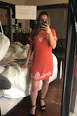 I'm 5 foot and a size 4. Normally I wear a size small but for this I sized down and it was still a little long and loose. It's not loose enough that I would alter it. It's a perfect fit that's comfortable. It's formal enough to wear to a wedding, and it's cute enough to wear to a brunch. Overall I'm pleased. If you're like me and in between sizes, for this dress I would size down! - Sarah R.