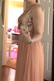 The dress is gorgeous and of great quality. It was so tight around my ribs I could barely breathe. Then to top it off the cut of the dress is totally different than what was pictured. I'm pretty petite and small chested and thought this would be perfect, but when I got it the front of the dress actually crosses over so it was super baggy and droopy unless I shortened the straps. Then when I shorten the straps it was an open V-neck like pictured. There were pleats in the fabric preventing you from being able to wear it the way it's pictured. I was so disappointed. - Madison B.