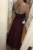This dress is beautiful. The quality is very nice and I absolutely love this color. I tend to be a size in between small and medium, but I went with the medium because I will be wearing it in my friends wedding. The tulle and lace are very soft and fortunately not see-through, so I don't need a slip or anything. I'm also pretty y'all and the dress is the perfect length. Will attach pictures (please excuse my bra straps). I am not wearing shoes in them and the dress touches the floor, so it will be perfect with heels. - Ellie M.