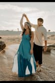 I wore this dress for engagement photos on the beach and I absolutely loved it! It was flowy, but the slits on the sides made it really sexy. Highly recommend - Kylee P.