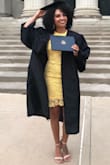 I ordered a small and a medium size in this dress. I wanted to make sure it was a perfect fit for graduation. I'm a little curvier in my stomach area so I was afraid a small would be too tight. Turns out, the small fit like a glove. Not too tight or hard to walk in. This dress had enough room to breathe so you're not dying while sitting. The fabric was soft and very comfortable as well. I recommend the yellow dress because it brought such a pretty warmth to the black gown! Best dress I have ever worn :) - Samantha