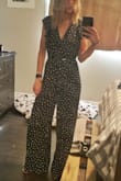 I have had a really hard time finding a cute romper that is long enough, small enough in the waist, and still cute. This is everything and more. The small was sold out so I got the medium and due to the fact that it wraps and you tie the top it fit just fine. The legs are long enough, I can even wear a small heel wit them if I want. I was worried having a fairly large chest and not being able to get the full support of a bra but honestly I didn't have any issues with that at all. I have only worn it once and I had multiple people stop me and tell me how cute the outfit was. So happy with it! - Brittany R.