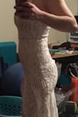 *I realized after I returned that the pictures I got were terrible, please ignore the mess*

I loved this dress online - until I put it on. I still think the dress is pretty, but ultimately I returned it. I also had a different lace design than the pictures which I wasn't a super fan of. Mine also puckered at the end of the zipper giving me a little tail - I'm sure that could have been easily fixed. - Rachael V.
