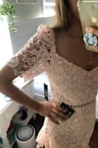 I don't know why the other reviews on this are so negative, I love this dress! It's really flattering even on an athletic body. I'm short and was expecting it to be too long, but it hits mid-shin which is great for me. It could be a little tighter, but I think the XS might not be the most comfortable for my needs.
The only slight problem is I got it for a wedding where I'll be dancing (a lot), and the sleeves make it hard to lift my arms above my shoulders. I'm going to bring it to a seamstress to have the sleeves turned into straps! - Campbell S.