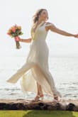This dress is absolutely stunning! I bought it to wear for my wedding ceremony in Maui Hawaii. It is the perfect beach wedding dress if you don't want to be super fancy but it's nice enough to give off the wedding vibe and flow in the wind at the beach. The bust part is a little tight but it's still flattering. I had to get the dress taken in on the straps and the length. I highly recommend this dress! - Rachel K.