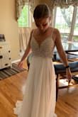 I ordered this dress after trying on tons of dresses in stores and just couldn't find the perfect dress. I even tried some other online sites for a dress, but still wasn't getting what I was looking for. I am getting married on a beach with just my fiance and I so I wanted something simple and to not spend a ton of money, so when I searched Google- Lulus came up. This dress is absolutely perfect! It's pretty long on me (since I'm short), so I'm going to get it hemmed and leave a little in the back for the train. I also am getting it taken in a little in the straps, but other than that, it fits like a glove! I am so happy with this purchase!!! I love the beading on the top, it looks like it is worth so much more than the true cost. The nude backing behind the top doesn't look as obvious in person as it did in the pictures on the site. It's very classy and elegant, but also sexy in the back. I am so glad I found Lulus so that I could say YES to the dress! - Madison P.