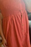 I love this dress because the length is modest, it flows very well and while it's not heavy it's also not see-thru! The only complaint I have is that right at the waist under the elastic top, there is a hole created between the buttons (see the second picture). But overall this dress is super cute and I can't wait to wear it this summer! - Amanda L.