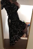 My actual bra size is 32M in USA size, 32J in UK size. Because of this I have a hard time finding dresses that can fit my extremely huge breasts AND my relatively thin 32 underbust. The wrap dress is the perfect solution! I was able to wear THIS dress without pinning it (with a cute slip) and it looked great on me! I got so many compliments. It stayed tied the whole day and was super comfortable. Without a slip I would have pinned the bottom to avoid flashing in the wind with the high/low cut. I got a little hot walking to my car but I was wearing spanx and that slip- I think this is a clearly SUMMER floral black dress and I was happy to pull off black in June during the daytime. If I had smaller breasts I would have gone a size down, but for me the size I ordered was perfect. - Abigail S.