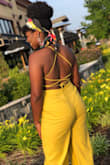 I don't usually post reviews, but honey...this jumpsuit! Easily one of my favorites! (It got a lil wrinkly because I had sat down for a while, but it's still cute lol). Anywhos..beware that the "hooks" that hold the straps in are pretty sturdy, so long as you don't pull too hard! While tying the back up my mom had pulled too hard (because we were trying to hold the lil girls up hello) and one of the hooks broke. Fortunately enough, my neighbor was able to sew it back on. Buuuut yeah..I will deff be ordering different colors. - Jalen M.