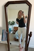 I'm pretty tall - 5'9" - 5'10" -  and this Large fits perfectly. Love that the back doesn't have any coverage - it means I can wear this with white pants, shorts, you name it! I bought it in both a black and the mauve and love both. - Samantha W.