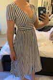 Loved the stripes and the style but it was way too constricting on (no raising your arms ladies!) and a bit matronly on. The chest was cut a little high, but it just resulted unserious cleavage, so not a total loss. The skirt is very stiff and creates a wide frame though, so not my favorite look. - Lara S.