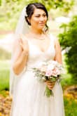 Great value and a beautiful dress! I wasn't sure of this dress when I first tried it on (I thought it might be too simple) but once I added my accessories, I truly felt like a bride! It is elegant, airy and romantic. I got soooo many compliments and no one could believe the price point! - Ashley D.