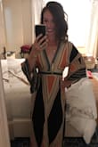 Love this dress! It's very low cut and since my chest is wider set, I got it gemmed an inch higher on the plunge. I wear little pasties with mine since you can technically peek in if I bend the right way. Such a great purchase! - Cait B.