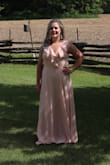 I wore this to my brother's wedding and got lots of compliments! I gain my weight in my stomach and it hid it quite well and was not tight (has some give at the back). Very good quality! I did hem it as I am short and I took the slit up a bit higher to compensate. The blush does feel like it washes you out a bit (I would definitely agree it would look better with a darker skin tone), but I still loved it! - Danielle B.
