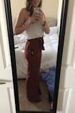 I absolutely love the marsala color and the fabric is so soft and flowy. Unfortunately, the fit is a little tight on my thighs even with a large, which usually leaves me a little room. it seems like they want to hug higher up so they can flare out at the bottom, but I'd prefer it just to be flowy all the way down like the daybreak pants Lulus also sells. 

The length was perfect for me, which was a pleasant surprise because I'm fairly tall and was ready to wear these as a crop like I normally have to, so they will probably be too long for shorter people.

I'm absolutely heart broken that they don't come in a larger size to fit my thighs loosely. I would've invested the money to have the rest tailored down, that's how awesome these look! - Christine H.
