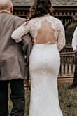 I wore this dress for my May 2019 wedding and let me just say that this dress is absolutely beautiful! I received so many compliments! Truly not many people could believe the price when I told them. The material is thick and the dress is made extremely well. Fits true to size-I am a small in most all of the tops and dresses that I wear. I am 5 foot tall and wore 4 inch heels. I still had to hem about an inch off the bottom of the dress. I included two photos so you can see the front and the back. I ordered a belt from David's Bridal but did not attach it to the dress. I had a second, shorter dress (also from Lulus!) that I changed into and wanted to be able to wear the belt with that one as well. Also, I wore spanx underneath to prevent shadowing and I would highly recommend that. I am so glad I went with this dress! - Nicole K.