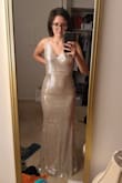 I'm going to wear this for my wedding reception. I previously got my ceremony dress in an XS, but the material had no stretch and it is a bit tight on my hips, so I got this one in a small and it's fits pretty well. With the stretch I could probably fit in an extra small too, but I couldn't go a size up because I'm not busty enough. My waist is 28.5 when relaxed and 26 when I flex my abs. The length is perfect when I wear 3 inch heels. As you can see in my photos it's not really silver, but I think it looks close enough in real life to the photo. I'm standing in a very warm light in my picture. - Nora F.