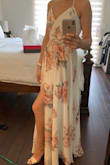 Fits perfectly! Wore this for family photos. I did have to get some fashion tape for the chest area to avoid any accidents even though there is a tiny snap there. Also, you kind of have to purposely move the dress material if you want the slit to open and show any leg. - Linda B.