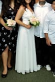 Gorgeous dress. It's a little more formal than expected due to the material on the bottom half of the dress. It runs a little large and is very long but nothing a tailor couldn't fix. Used this for a very intimate wedding ceremony with our kids. - Noell S.