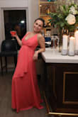Loved the coral color and light weight flowy feel! I am 5'4 and the length was just right with a pair of 4 inch gold heels. Received lots of compliments. :)
I wish the shoulder straps were adjustable but I had enough time to take the dress to the tailor and got the straps taken down about 2 inches. I am a 32D bust, yet I felt the chest area would have been loose and exposed had I not gotten the shoulder straps adjusted. Aside from that small detail - dress is perfect! - Maribel C.