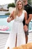 I wore this to my Bridal Shower and it was absolutely perfect! I did have to get it taken in a bit and had it tailored so the middle part of the dress was lifted up because it was so long the slit started in the middle of my calf when I first got it. The alterations turned out perfectly! I love it! - Ali A.