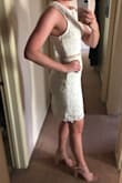 This dress doesn't have stretch and is a little big in the bust area for me, but overall it fits really well, doesn't feel too short, and is SO cute! Planning on wearing it for my bridal shower! - Shannon D.