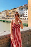 What a great red dress! I love the fabric and the details. The slits in the front of the dress & the open/tie back gives it such a unique flare! This dress runs true to size so perfect for online shopping! I would definitely recommend it for this summer! - Emily R.