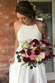 I knew right off the bat that I didn't want to spend a crazy amount of money on my wedding. I started looking at local wedding shops and all of the "affordable" dresses were flat out not cute. I was looking for something with the boho/hippie vibe & wasn't finding it in town. A cousin sent me Lulus website and I kept finding myself going back to this dress over the course of a few weeks. It appeared to be what I was looking for but with such a cheap price, I thought it for sure was too good to be true. I finally thought, for $112, what do i have to lose? Even if i hate it, I didn't spend too much. When the dress came in, I was ABSOLUTELY SHOCKED that I loved everything about it!! I definitely recommend speaking with Lulus online customer service assistants via webchat to help you order the correct size based off measurements. Although it was a tad big on the top, overall it worked and I got so many compliments. People were shocked when I told them it was only $112. Getting my wedding dress from Lulus was one of the best choices I made! Ladies, there is no need to spend thousands on a wedding dress when you can order from Lulus like I did and use that money to go towards a honeymoon instead :) - Krystal B.
