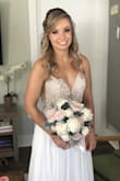 I bought this dress as my wedding dress. Waiting forever for it to come in stock and it was well worth it. I completely agree with the reviews... beading doesn't look cheap at all (I was worried about this). The dress is beautiful and looks very high quality.
It's very long but I am short and assumed I'd have to get it taken up. I left the dress longer at the back to create a train.
I was borderline between ordering the size 2 or 4 but I'm glad I ordered the size 2. The only place it is really fitting is on the ribs and the chest. I would recommend again and again.
People were blown away on my wedding day buy this dress! - Stephanie M.