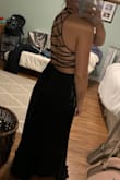 The dress is slightly long on me, but nothing a pair of heels can't fix. The straps down the back took a few minutes to get on and the help of someone else to adjust, but once on, the dress is beautiful. - Kaley R.