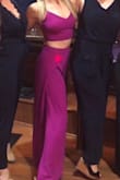 This jumpsuit might be my new favorite thing in my wardrobe. I have never received so many compliments on an outfit before. The magenta color is so beautiful in person. Due to the tightness of the top and the adjustable straps, I didn't have to wear a bra and I ALWAYS have to wear a bra. I'm a tall gal so jumpsuits are usually pretty difficult for me to wear, but these pants hit right at the floor. The only issue I had with it (as other reviews have stated) is that when I sat down, it could be a bit revealing at times. My upper thighs would show almost all the way to my hips. It was fine, but I just had to be very cognizant of it when sitting. I can't wait to wear this again - it's definitely a show stopper! - Laura M.