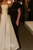 I ordered this dress as a bridesmaid dress. I tried XS and S and kept the XS. It was really long, I took 3 inches off the dress length and still wore 4 inch heels. The material was nice, it had a little stretch to it but very form fitting and felt textured. I was unable to wear panties as even the seamless ones still showed a line. I received many compliments. The reason I have 4 stars, the stitch work on the ruffle part was poorly done. - Katie B.