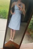I really liked this dress as it came.  However, being 5'8, it hit at just the wrong spot so I took the length up just about 2 inches. I also couldn't help but think about how cute it would be as a halter dress, so I also had the straps altered to tie behind my neck. I LOVE IT. 

my bust measures a 30DD, or 35" around the fullest part, this is the largest I would recommend for the XS (the zipper is snug but not too binding). 

First pic is before alterations, second is after. - Sarah B.