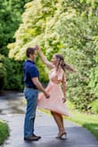 Bought this for my engagement pictures. Beautifully flowy, and the peach color was bright and pretty. Wrap lets you dictate how loose or tight you'd like it to fit. I used some body/fabric tape to keep the neckline in place, and the tape did the trick. If I had been moving a lot, maybe it would have been too much. Considering how deep the v is it was still proper looking, just the right amount of sexy and not too scandalous. Just be ready to show off your assets. Length looked great with the right heel on my shorter stature. Would have looked odd without some sort of heel though at my height. Would definitely recommend. - Jen R.