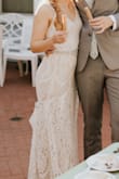 Was a little long for my height. Was able to hem inside material and wore heels so the front lace was not too long to walk in. Per another review, added faux pearls to straps which looked beautiful. - Sarrah S.