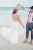 I bought this dress for my destination wedding and it was absolutely stunning on the beach! I received so many compliments from my quests and they couldn't believe the amazing quality for the only $250 price tag! I look at designer dresses and this one was by far the winner. I did have alterations done for the length and to adjust the straps as they were a little long for me. Otherwise the fit was perfect. Do yourself a favor, a buy this dress for your wedding!
Photos by: Megan Morse Photography - Natalie D.