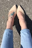 I love these slip ons! The strap fall down sometimes. I may have to get it tightened by tailor, but the shoe stays on regardless. So cute. - Julia M.