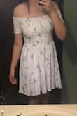 I'd been waiting to get this dress for a year, so I'm a little disappointed.. the material wrinkles IMMEDIATELY and after fluffing in the dryer and using wrinkle spray, the wrinkles just got worse. If you're expecting a soft cotton material like I was, it's not that at all.
I'm a little tall but I ordered my usual size and the length is a lot longer than it looks on the model, but the top ruching still ends well above my actual waist, which is weird. It looks pretty good from the side, but the front view has something off about it. 
I'm still keeping it, it just wasn't the cute effortless dress I thought it would be. - Alia S.