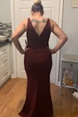 I bought this dress and another one for an upcoming wedding. I didn't keep this one because it was a little too low cut for my liking. However when I tried it on it fit perfect and I loved the color. It was pretty long so had I kept it I would've needed to get it hemmed. - Stephanie L.