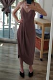 I ordered this dress in Mauve, XS. The dress appears to be quality material and well made. I really liked the style and length of the dress, but unfortunately it was way too large. If I had a much larger chest the dress might have worked, but as you can see from the pictures I think it still would have been ill-fitting. I'm disappointed this didn't work for me, as the dress looked lovely on other reviewers! - Clara V.