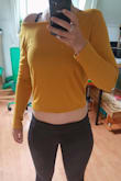 This model is super short (seriously, almost a crop top). So only with very high waisted pants or skirts. Otherwise, you will show your belly. More than on the model. Color and fabric are really nice, although a bit darker in real life. I will add a simple ribbon for the neck; otherwise, it falls off the shoulders way too much.
Overall nice and funky top. - Marjoleine K.