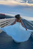 I ordered a small and it fit perfectly. This dress was absolutely beautiful and I was completely happy with my purchase. - Casey K.