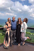 I wore this dress to a mountain top wedding. I ordered the M and felt like I could have sized down and had more support in the chest area. I decided to go without a tank underneath. I did wear a plunge neck maidenform body suit underneath and never felt as if I was going to have any wardrobe malfunctions. The fabric is very light weight. I stepped on the hem going up some stairs and put a hole through the bottom with my heel. - Lauren D.