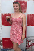 A fun summer dress! Love the bright red and has a fun back. It is pretty short, so if you are a tall girl it may be too short. Also the chest area is a little tighter than I like. - Alexandra F.