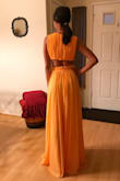 I ordered this dress for a summer black tie wedding! This color is definitely a standout, but also very unique and unlike anything else I own. I ended up hemming the bottom of the dress about 2.5 inches, so it would just skim the ground. It was also worn with a 3 inch heel. I am very pleased with my purchase! - Brandi W.