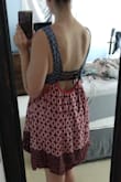 A lot of people said that this was super low cut and showed too much, but I was wishing for more cleavage! It's a great dress ! Super boho. Super cute. Extra lined and very durable/flowy material. LOVE. - Mikki B.