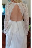I'm so in love with this dress!! I found it a while back before I even started looking for a wedding gown, and just automatically knew this was the one. I was scared it wasn't going to look like the photos, but it exceeded my expectations. The lace is very thick and the skirt has many layers... it looks and feels way more expensive than it actually is! The sleeves are a tad bit loose around the armpit, but it's really nothing noticable unless you walk around with your arms out. It truly fits like a glove and makes me feel like a princess. I can't wait to twirl around in it on my wedding day. - Megan L.